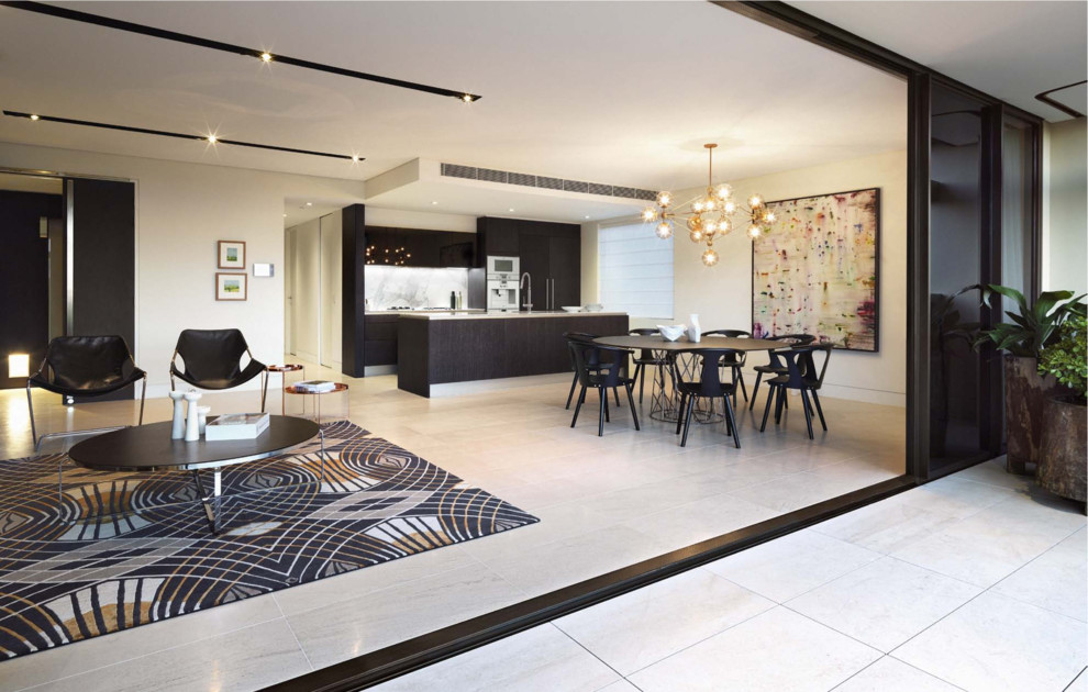 Photo of a contemporary open concept living room in Sydney with white walls and travertine floors.