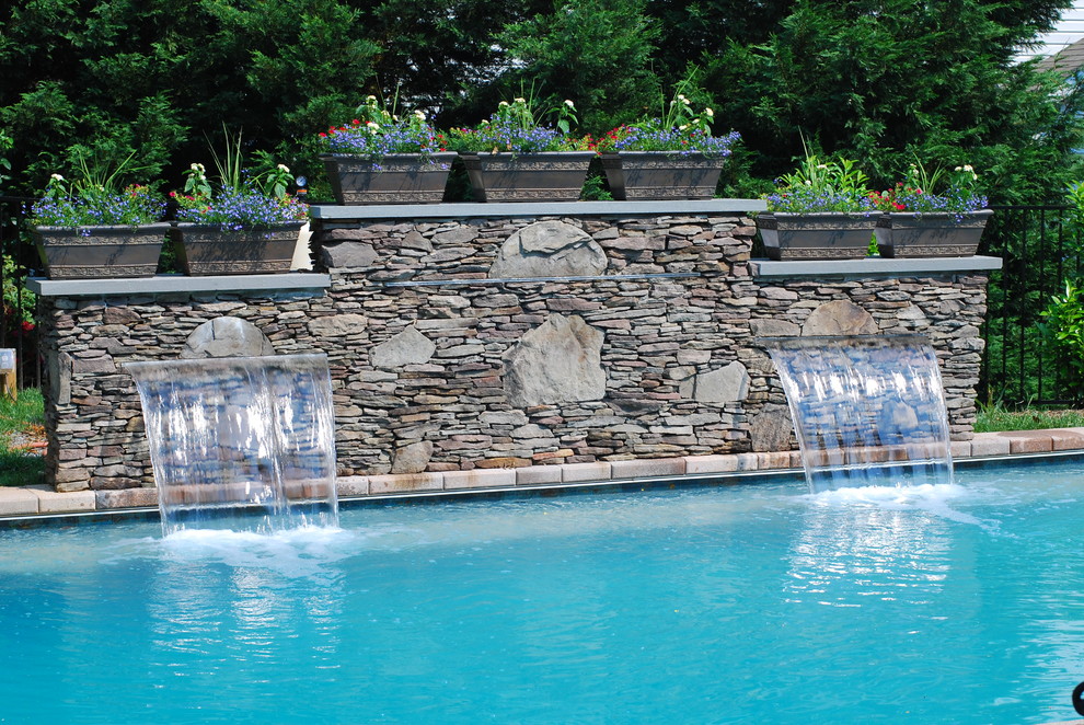 Inspiration for a mid-sized transitional backyard brick and rectangular lap pool fountain remodel in Baltimore