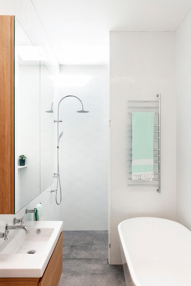 Small contemporary master bathroom in Sydney with flat-panel cabinets, medium wood cabinets, a freestanding tub, an open shower, white walls, concrete floors, a console sink, grey floor, an open shower, white benchtops and white tile.