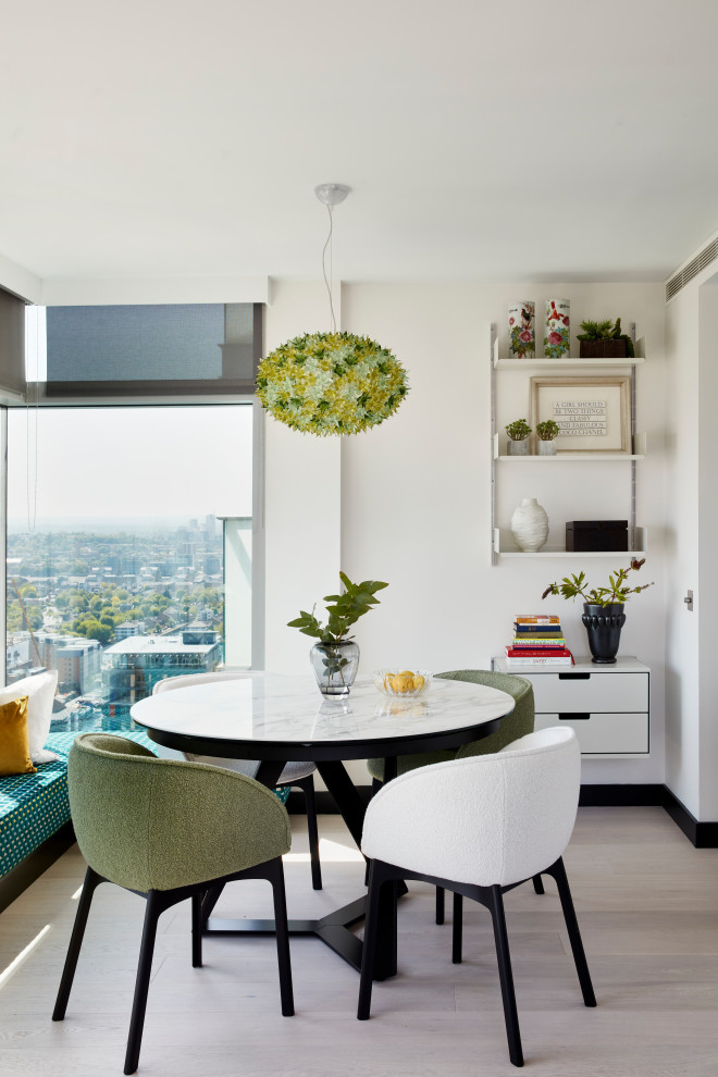Design ideas for a small contemporary dining room in London.