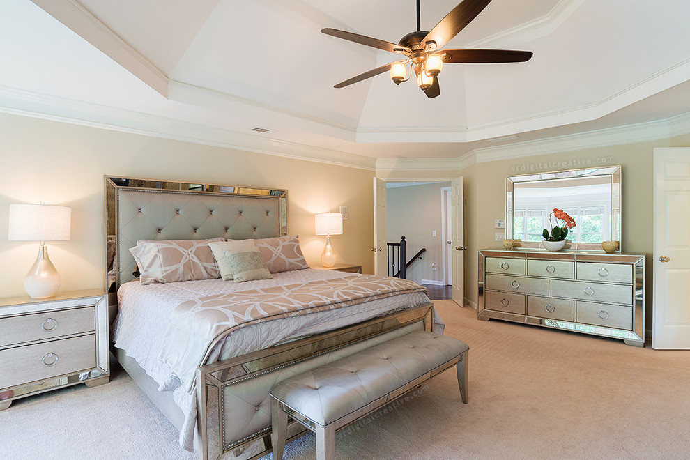 Photo of a transitional master bedroom in Atlanta with beige walls, carpet and no fireplace.