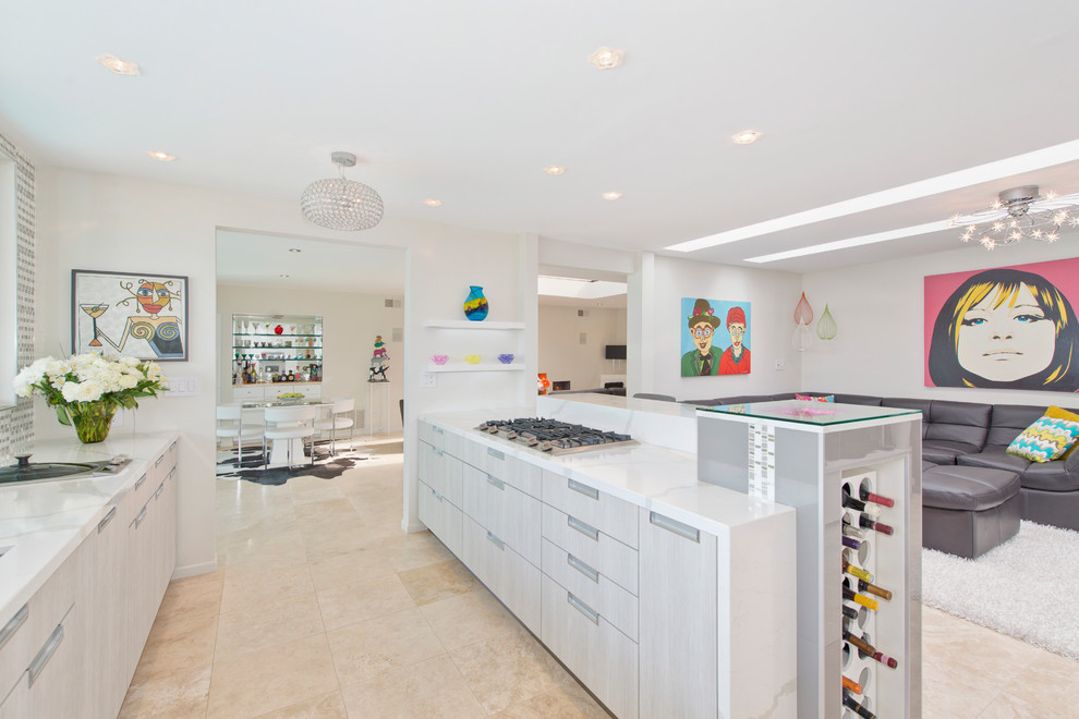 Inspiration for a mid-sized contemporary l-shaped open plan kitchen in San Diego with flat-panel cabinets, grey cabinets, a peninsula, an undermount sink, stainless steel appliances, multi-coloured splashback, mosaic tile splashback, travertine floors, solid surface benchtops, beige floor and white benchtop.