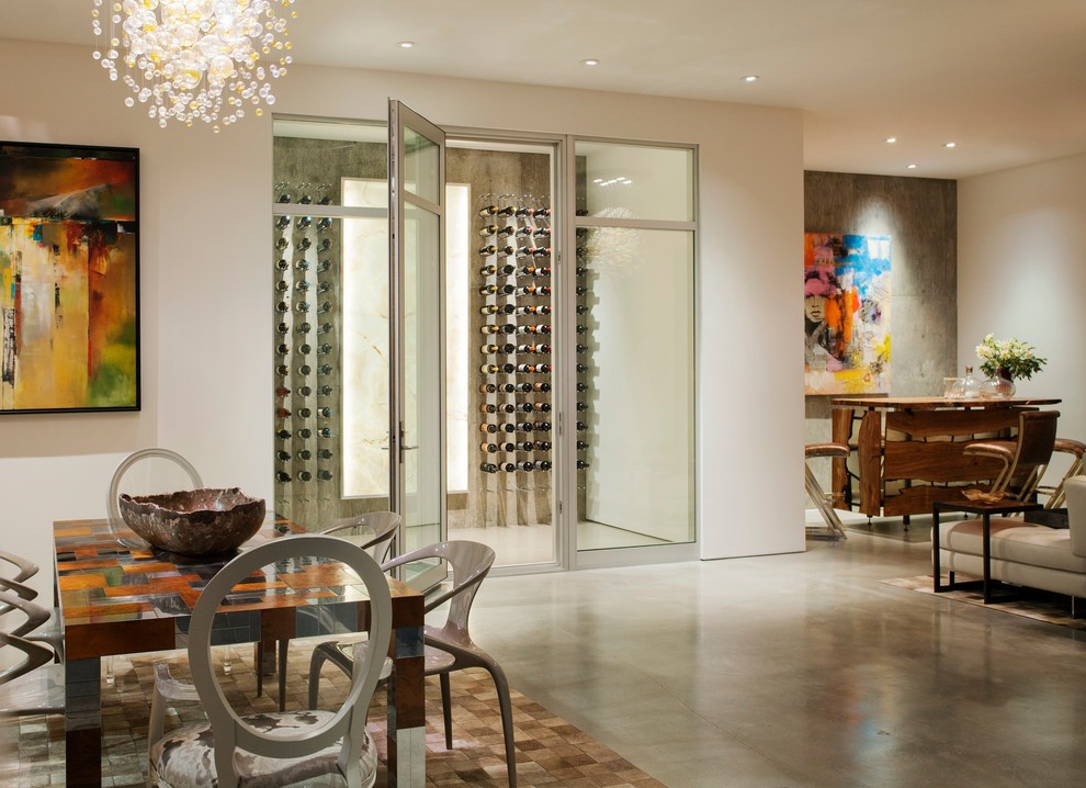 Photo of a contemporary wine cellar in San Francisco with concrete floors and storage racks.