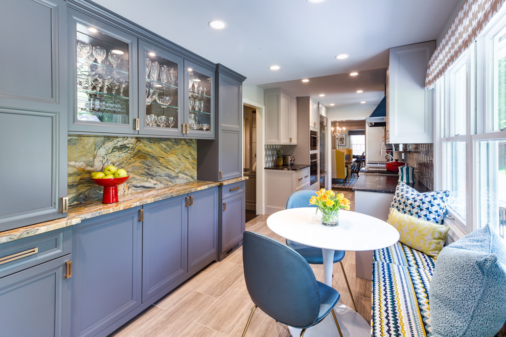 Mid-sized transitional galley separate kitchen in DC Metro with a single-bowl sink, shaker cabinets, grey cabinets, granite benchtops, multi-coloured splashback, stone slab splashback, stainless steel appliances, ceramic floors, no island, grey floor and black benchtop.