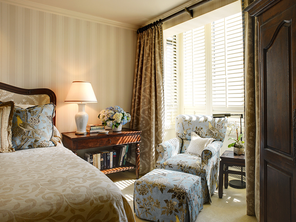 Photo of a traditional bedroom in San Francisco with beige walls and carpet.