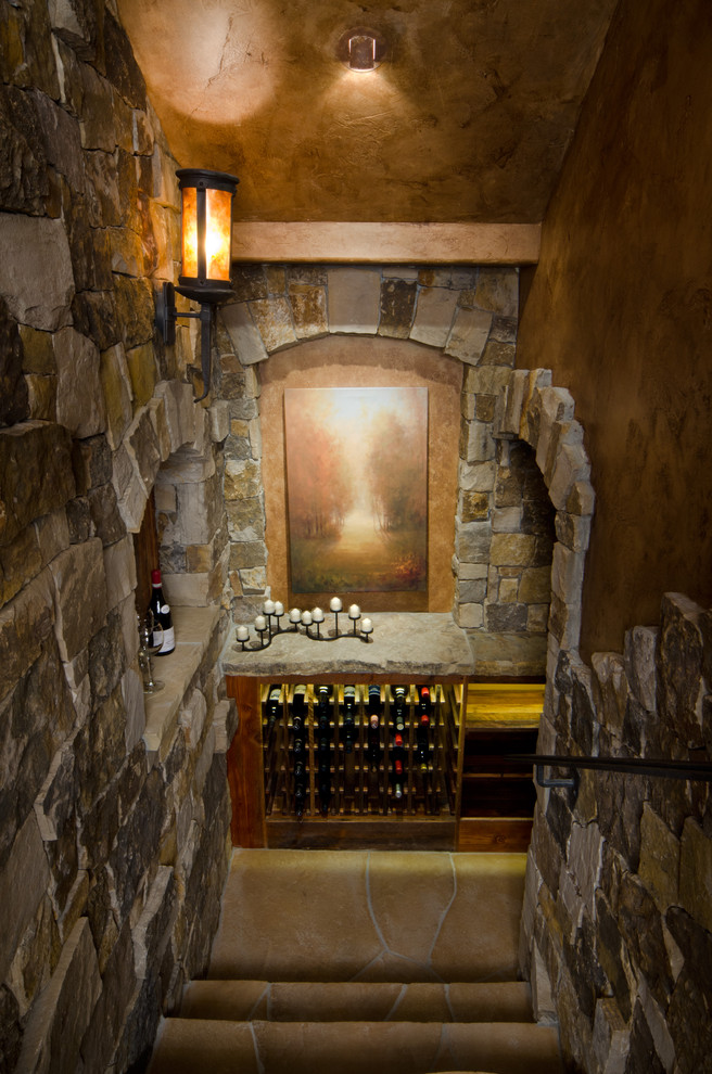 Inspiration for a large country wine cellar in Other with storage racks and porcelain floors.