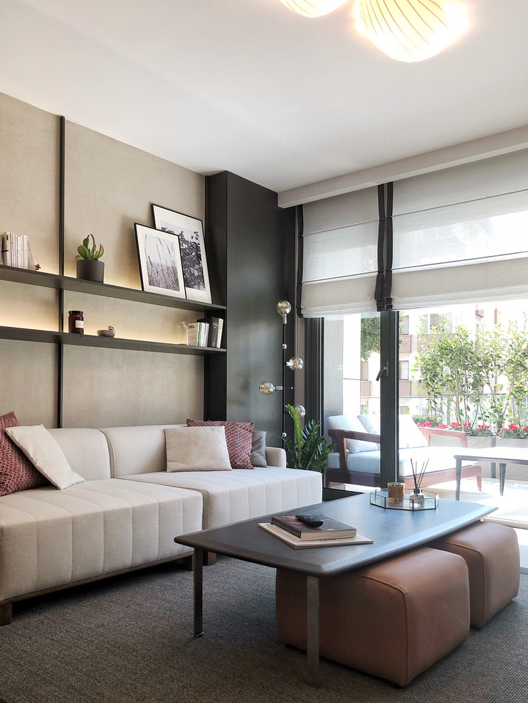 Small trendy open concept living room photo with gray walls