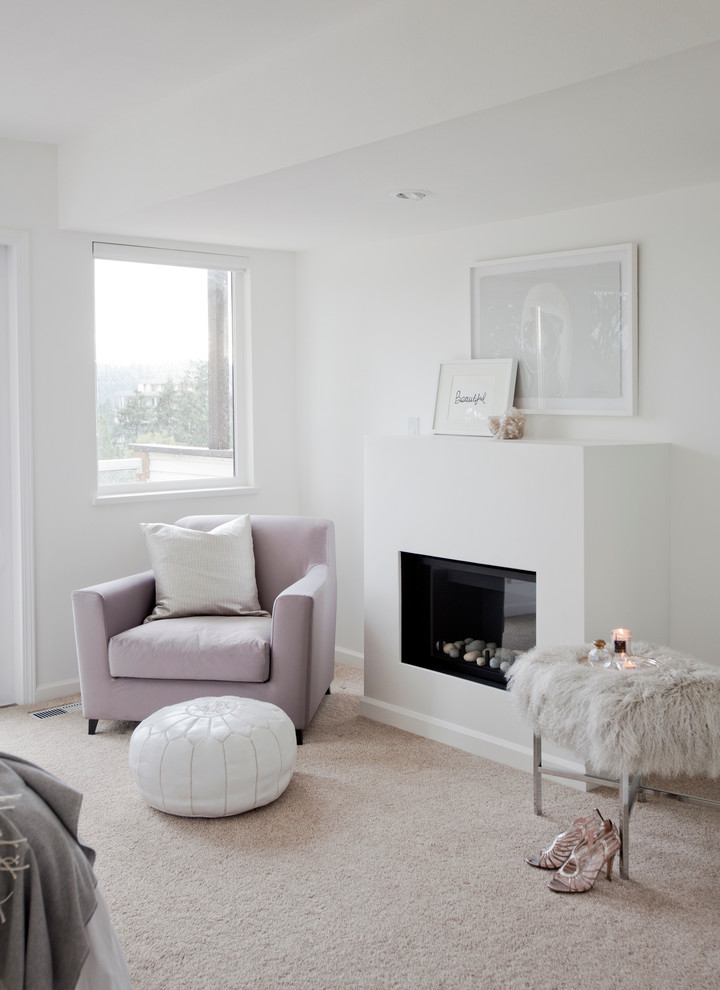 Design ideas for a mid-sized transitional master bedroom in Vancouver with white walls, carpet, a standard fireplace and a plaster fireplace surround.