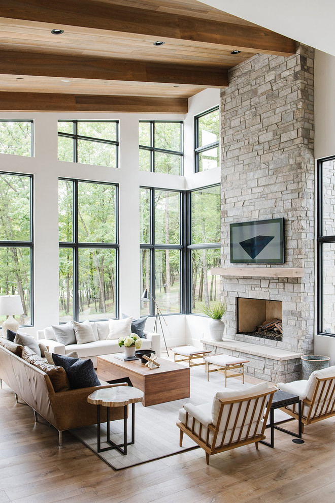 Large farmhouse open concept light wood floor and beige floor living room photo in Salt Lake City with white walls, a standard fireplace, a stone fireplace and a wall-mounted tv