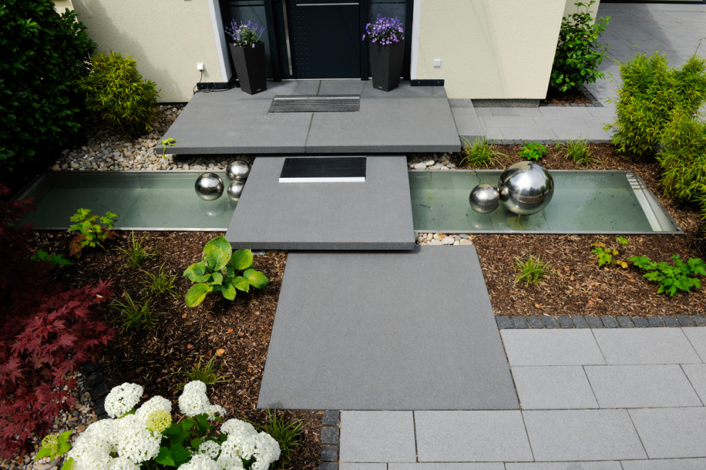Design ideas for an asian garden for summer in Frankfurt with with rock feature.