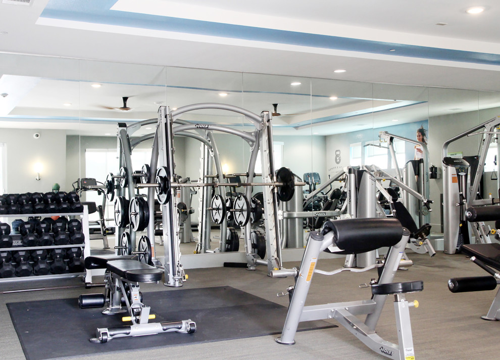 Design ideas for a large contemporary multipurpose gym in Austin with white walls, porcelain floors and grey floor.