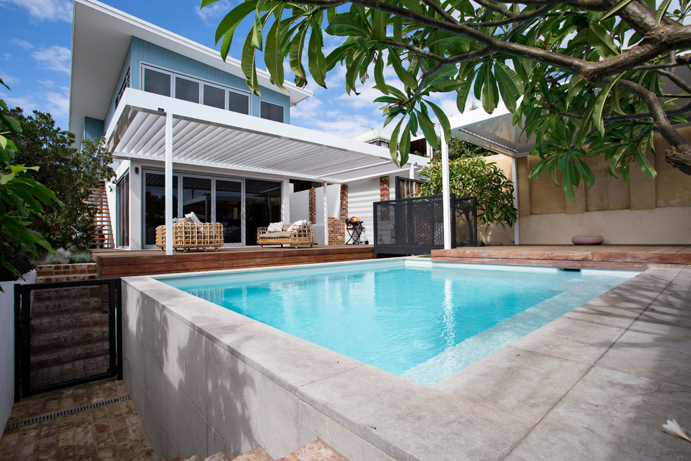 Design ideas for a small transitional backyard rectangular aboveground pool in Perth with tile.