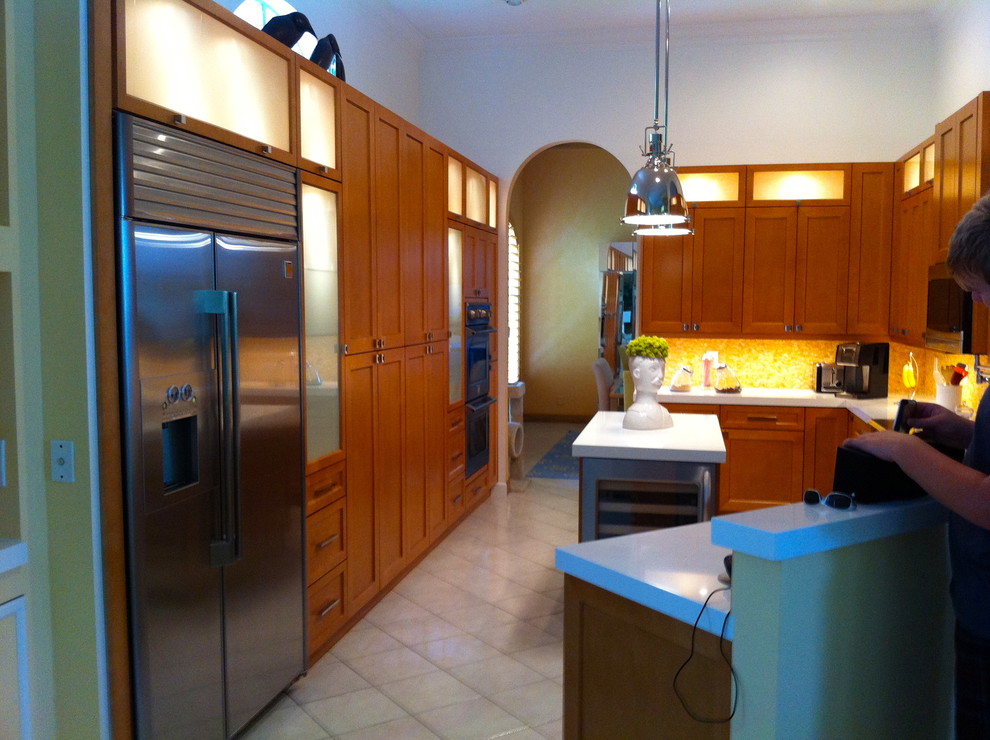 Inspiration for a large transitional u-shaped ceramic tile and beige floor open concept kitchen remodel in Miami with a double-bowl sink, shaker cabinets, quartzite countertops, multicolored backsplash, stone tile backsplash, stainless steel appliances, an island and medium tone wood cabinets