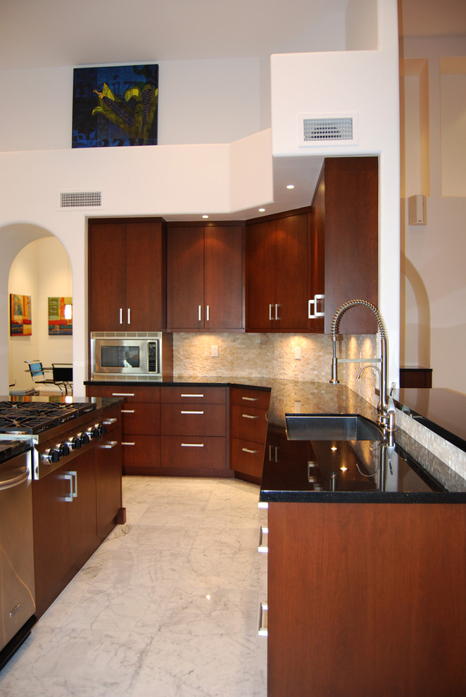 Design ideas for a contemporary kitchen in Phoenix with stainless steel appliances.