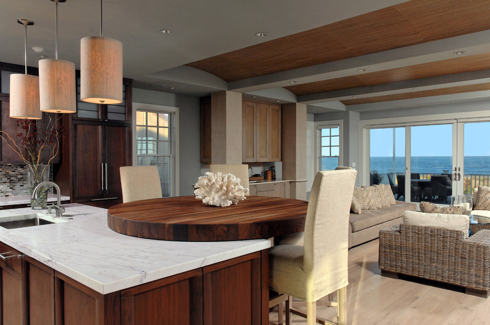 Open concept kitchen - mid-sized transitional l-shaped light wood floor open concept kitchen idea in DC Metro with an undermount sink, medium tone wood cabinets, marble countertops, mosaic tile backsplash, paneled appliances and an island