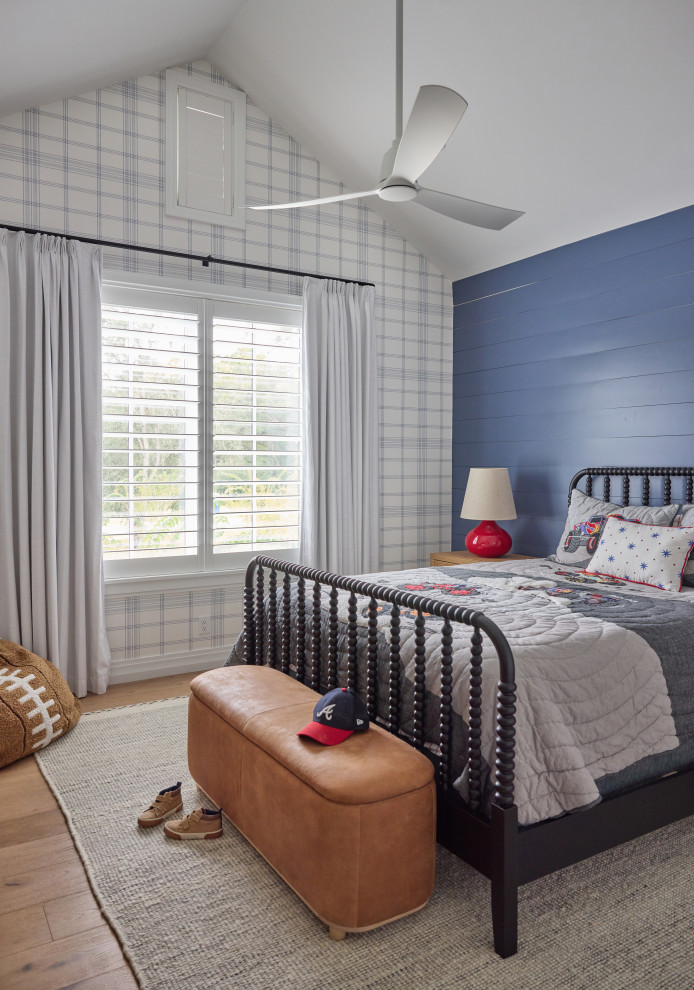 2 Chicks Happy Family Home - Boys' Bedroom with Navy Grid Wallpaper and Black Spindle Bed. A boys' bedroom designed to grow up in within this Ponte Vedra Beach custom home by 2 Chicks Design Co. A handsome plaid wallpaper, a spindle bed, a leather toy bench,Blue accent wall, and warm wood floors create a layered, lasting kid's room with adult-quality bones.
Tags: Boys Bedroom, Kids Bedroom, Spindle Bed, Navy Wallpaper, Transitional Kids Room