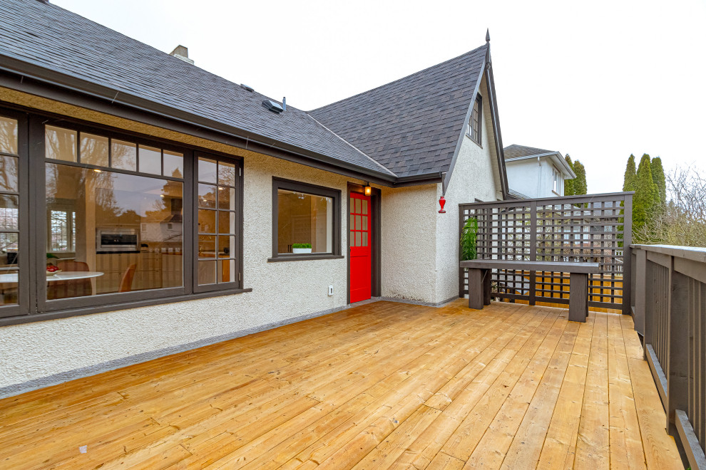Inspiration for a mid-sized transitional backyard second story privacy and wood railing deck remodel with no cover