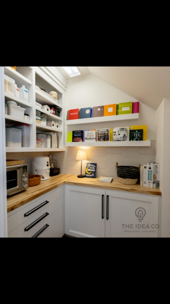 Kitchen pantry - mid-sized transitional galley light wood floor and brown floor kitchen pantry idea with a single-bowl sink, recessed-panel cabinets, white cabinets, quartzite countertops, multicolored backsplash, ceramic backsplash, stainless steel appliances, an island and white countertops