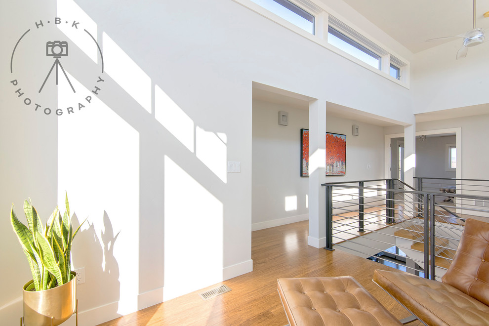Inspiration for a large wooden metal railing staircase remodel with wooden risers