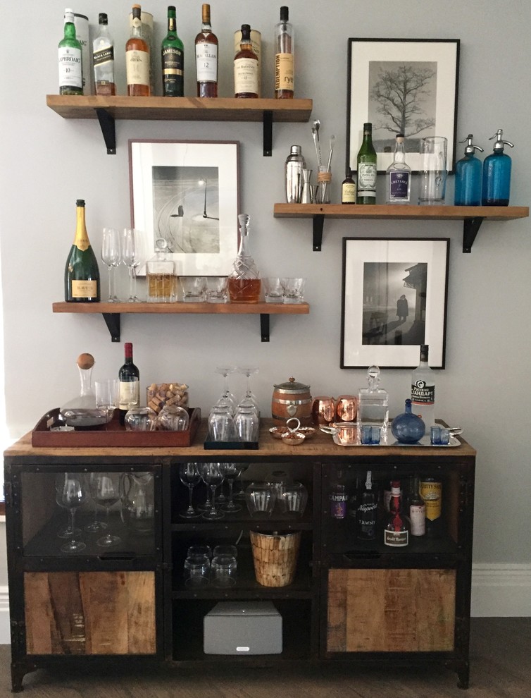 Inspiration for a mid-sized contemporary single-wall home bar in New York with wood benchtops.