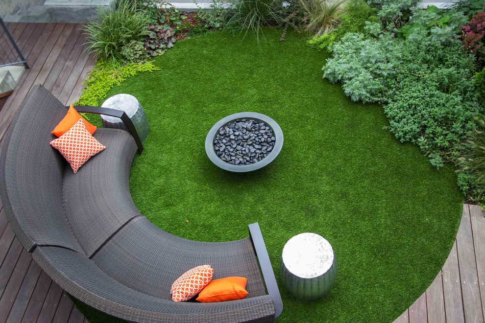 Trendy patio photo in New York with a fire pit