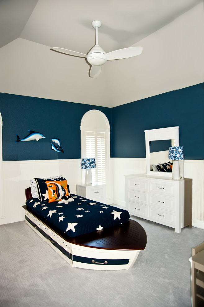 Kids' room - mid-sized transitional boy carpeted kids' room idea in Tampa with blue walls