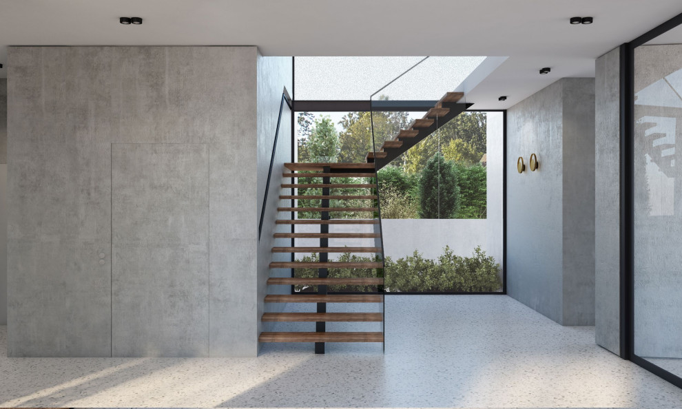Mid-sized contemporary wood floating staircase in Melbourne with wood risers and glass railing.