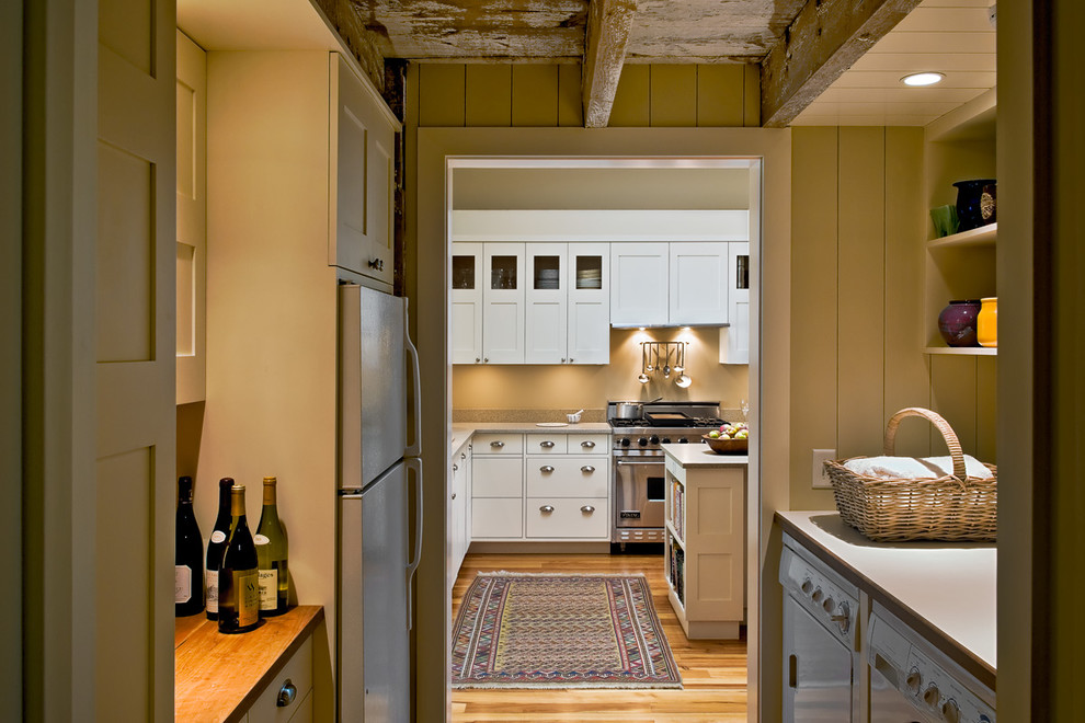 Design ideas for a country kitchen in Portland Maine with stainless steel appliances.