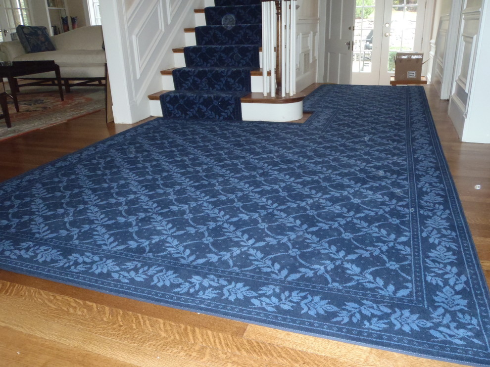 Inspiration for a mid-sized transitional carpeted straight staircase in Boston with carpet risers.