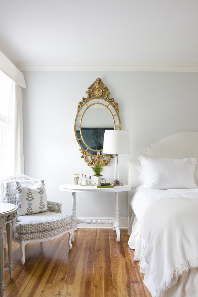 Design ideas for a traditional bedroom in DC Metro with grey walls and medium hardwood floors.