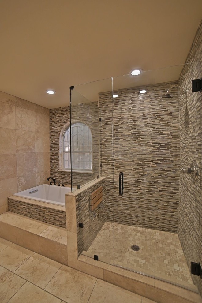 Inspiration for a large traditional master bathroom in Dallas with an undermount sink, shaker cabinets, light wood cabinets, solid surface benchtops, a drop-in tub, an open shower, a two-piece toilet, beige tile, glass tile, beige walls and travertine floors.