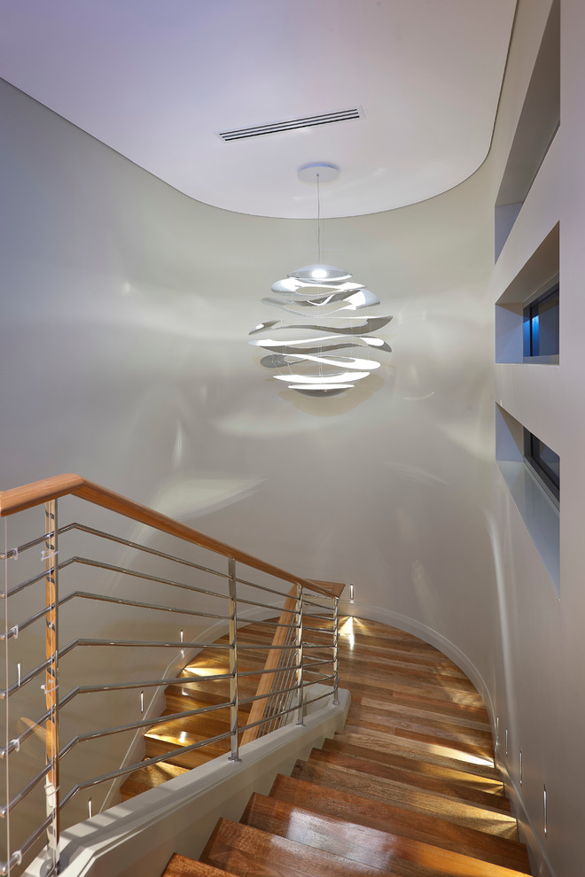 This is an example of a mid-sized modern wood u-shaped staircase in Perth.