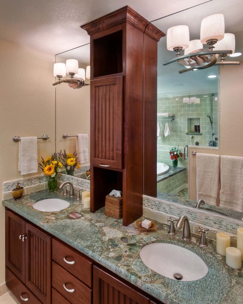 This is an example of a contemporary bathroom in San Francisco with granite benchtops, subway tile, an undermount sink and turquoise benchtops.