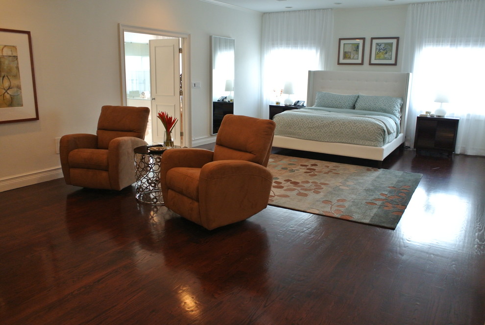 Photo of a large contemporary master bedroom in Miami with white walls and dark hardwood floors.