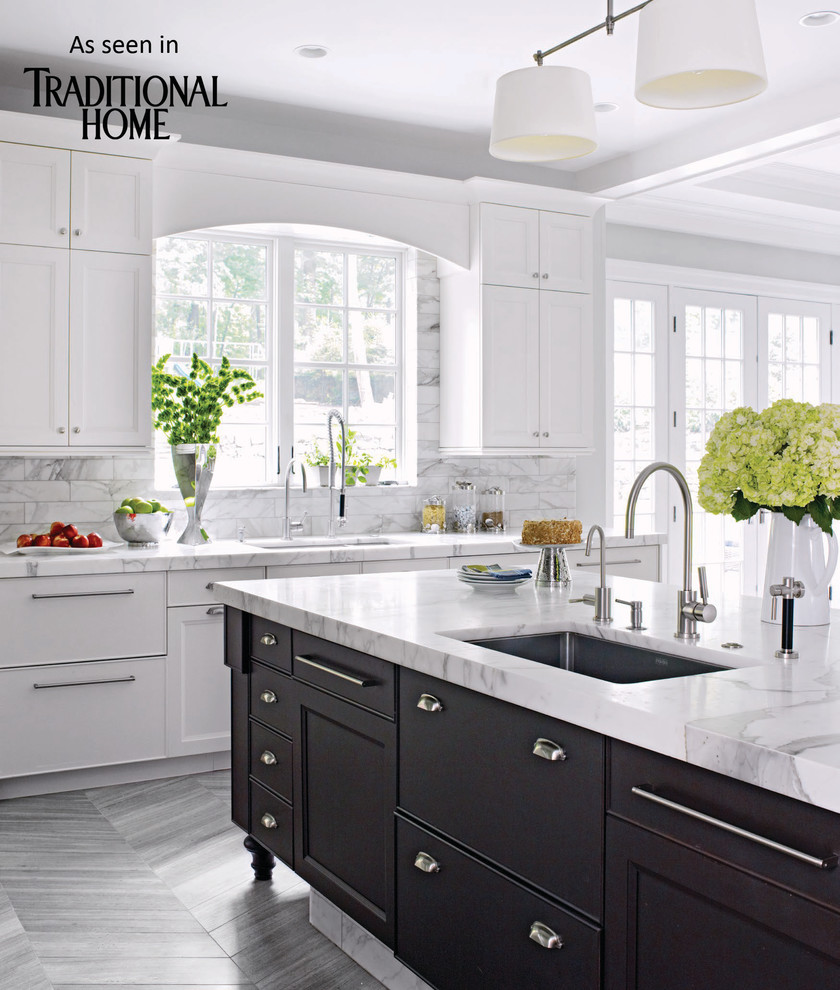 Example of a huge u-shaped marble floor eat-in kitchen design in New York with an undermount sink, shaker cabinets, dark wood cabinets, marble countertops, white backsplash, stainless steel appliances and an island
