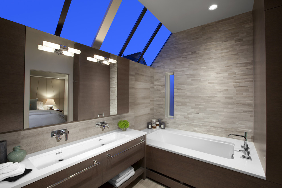 Large contemporary master bathroom in Vancouver with a trough sink, flat-panel cabinets, an undermount tub, beige tile, dark wood cabinets, a corner shower, porcelain tile, beige walls, porcelain floors and engineered quartz benchtops.