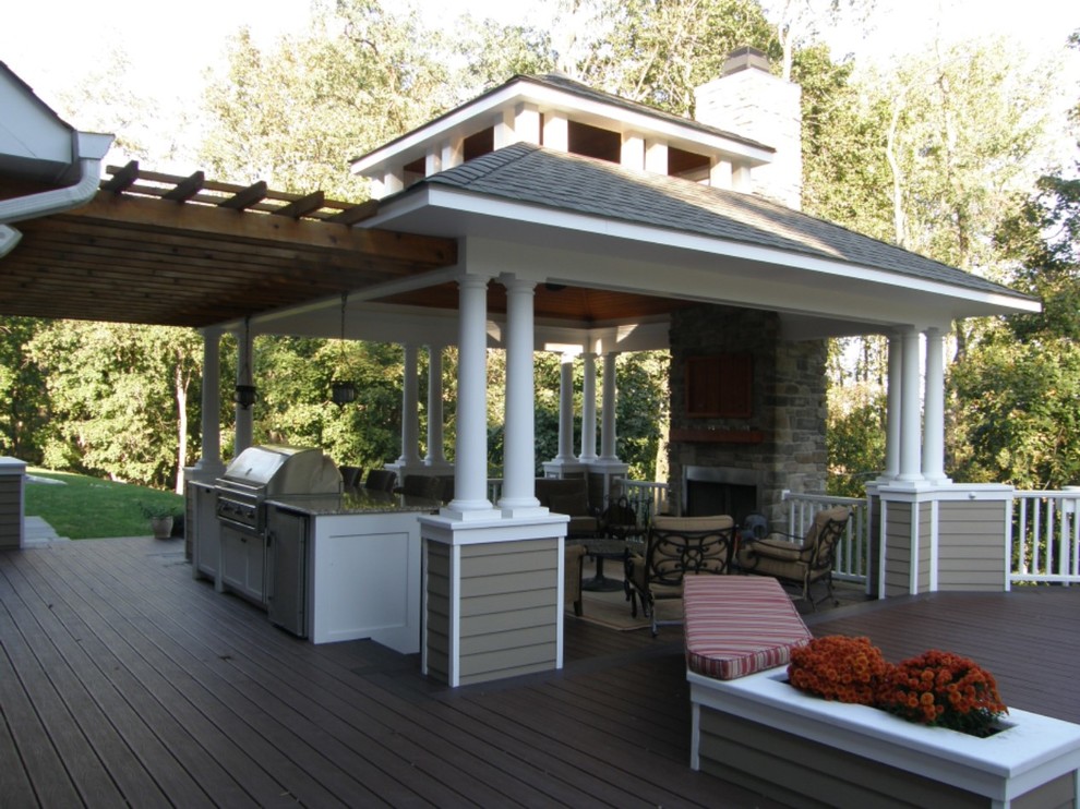 Photo of a mid-sized traditional backyard patio in Other with an outdoor kitchen, decking and a gazebo/cabana.