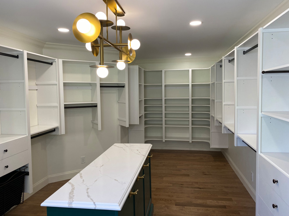 Photo of a large transitional walk-in wardrobe in Philadelphia with open cabinets, white cabinets, medium hardwood floors and brown floor.