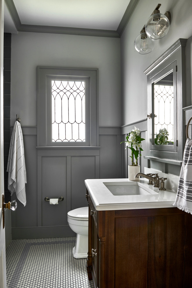 На фото: ванная комната в стиле неоклассика (современная классика) с серыми фасадами, душевой кабиной, белой столешницей, тумбой под одну раковину и встроенной тумбой