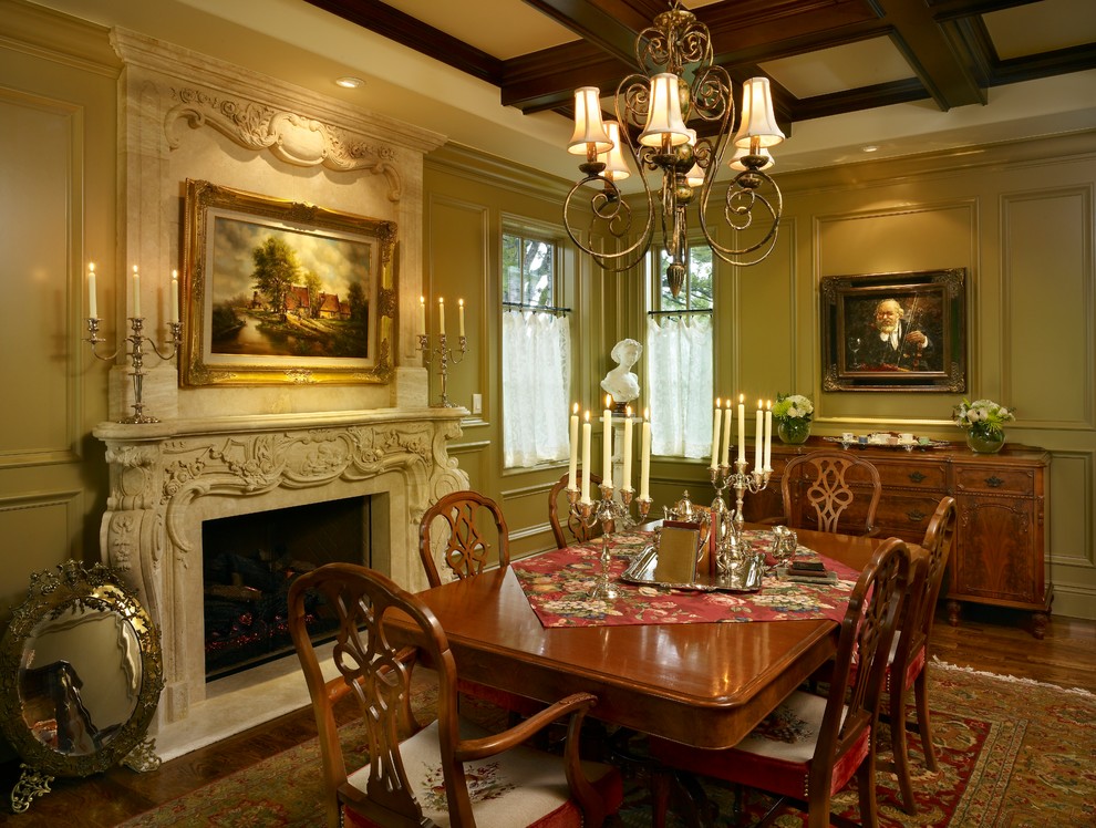 This is an example of a large traditional separate dining room in Denver with beige walls, medium hardwood floors, a standard fireplace, a stone fireplace surround and brown floor.