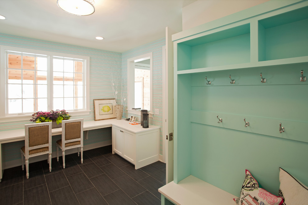 This is an example of a beach style mudroom in Minneapolis with blue walls.