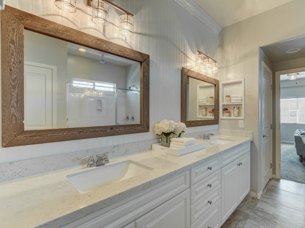 Inspiration for a transitional master bathroom in Las Vegas with white cabinets, a double shower, white tile, marble, grey walls, ceramic floors, an undermount sink, grey floor and a hinged shower door.