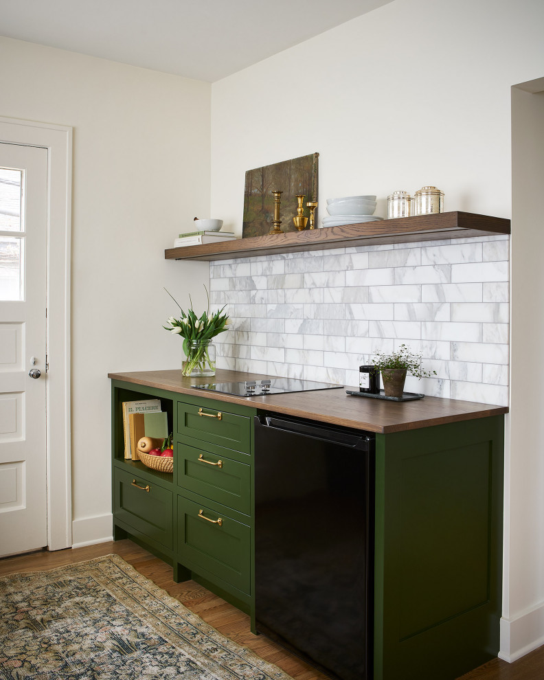 Design ideas for a small traditional single-wall kitchen pantry in Chicago with an undermount sink, open cabinets, medium wood cabinets, wood benchtops, grey splashback, marble splashback, black appliances, medium hardwood floors, brown floor and brown benchtop.