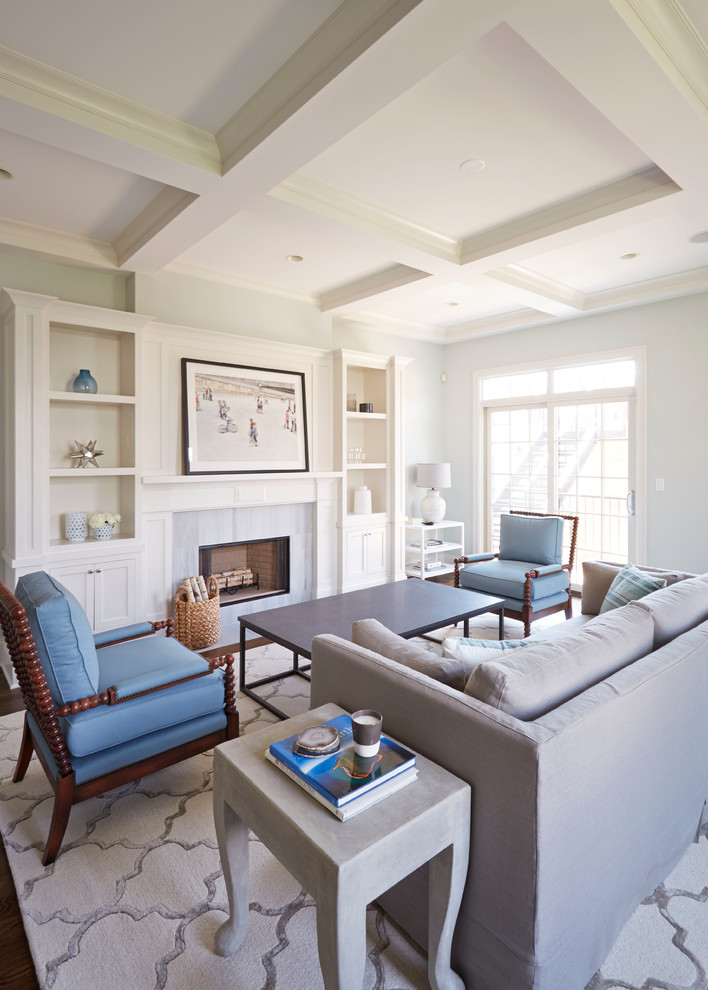 Inspiration for a mid-sized transitional open concept family room in Boise with dark hardwood floors, a standard fireplace, a stone fireplace surround, a wall-mounted tv and grey walls.