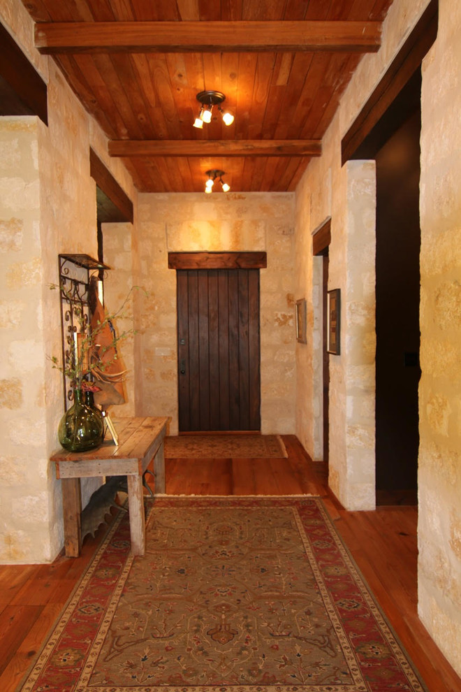 Inspiration for a rustic entryway remodel in Austin