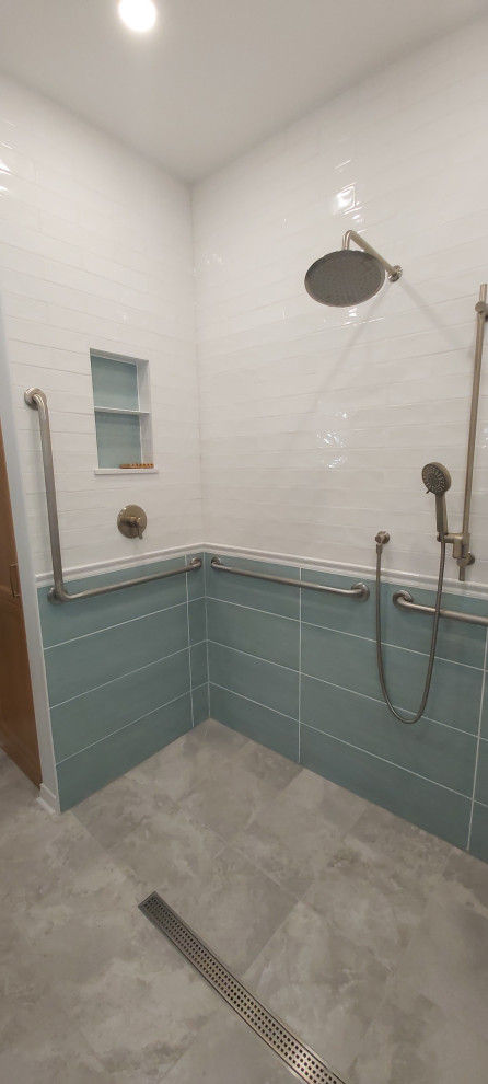 This is an example of a mid-sized transitional master bathroom in Ottawa with recessed-panel cabinets, beige cabinets, a curbless shower, a two-piece toilet, white tile, subway tile, blue walls, porcelain floors, an undermount sink, engineered quartz benchtops, grey floor, an open shower, white benchtops, a niche, a single vanity, a built-in vanity and decorative wall panelling.