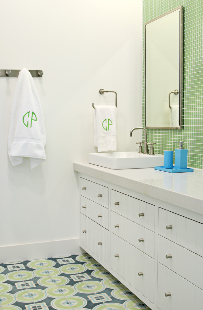 This is an example of a contemporary bathroom in Austin with white cabinets and green tile.