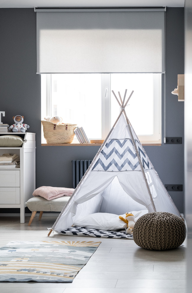 Inspiration for a small contemporary kids' playroom in Other with grey walls and white floor.