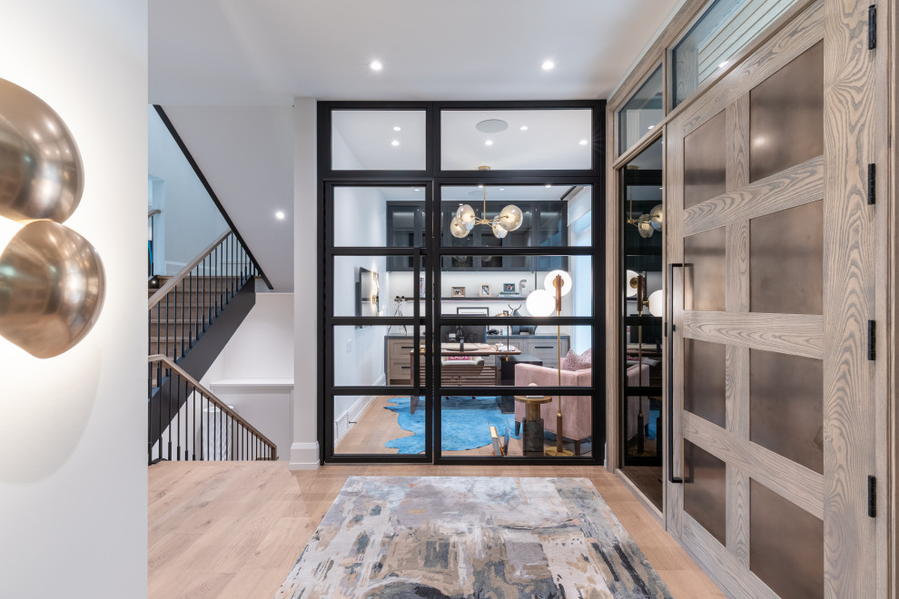 Example of a transitional home design design in Calgary