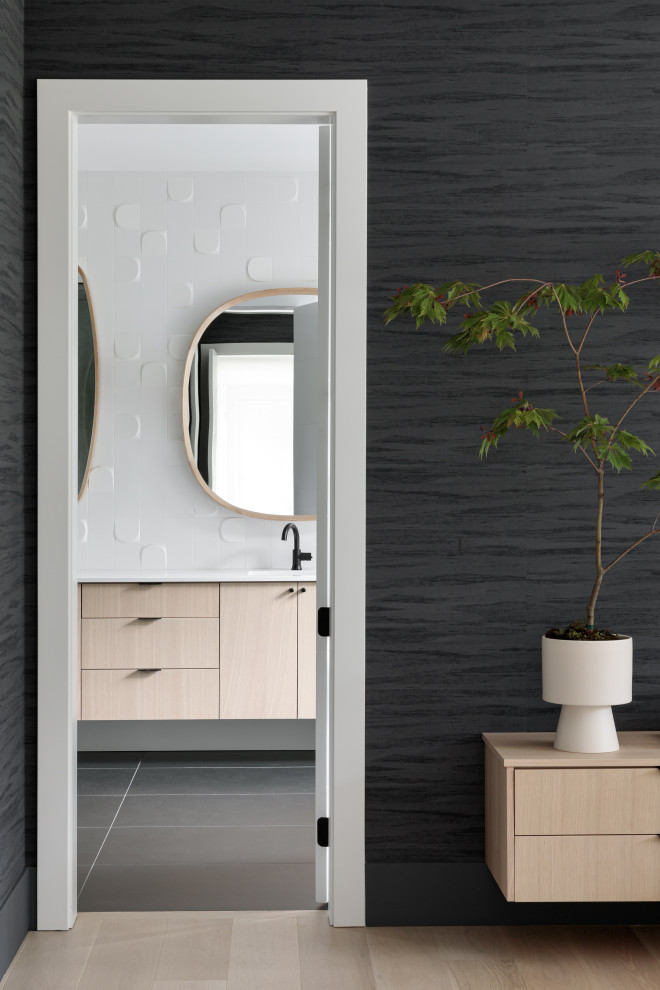 Inspiration for a mid-sized modern bathroom in Vancouver with flat-panel cabinets, light wood cabinets, white benchtops, a double vanity and a floating vanity.